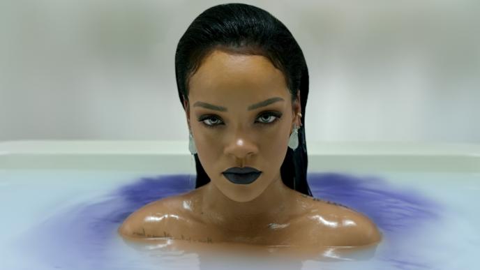close up shot of rihanna in pearly and purple hazy water