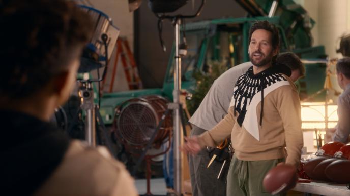 actor paul rudd with an american football ball