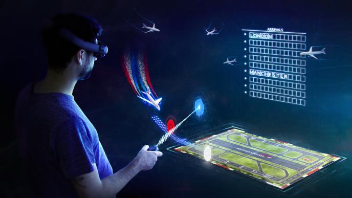 virtual reality of visit britain ar game with a person holding a controller. they are zapping a screen that has a plane, airport runway and flight board
