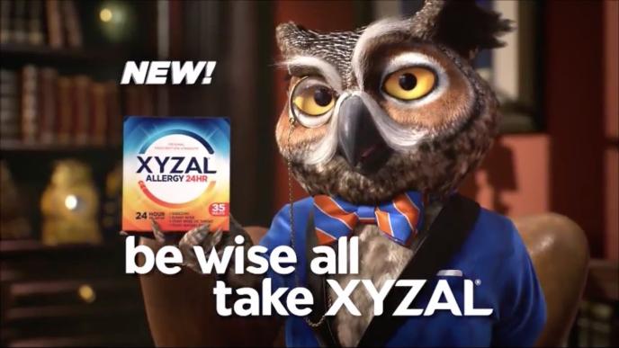 an animated owl wearing a suit and bow tie with the text 'new! be wise all, take xyzal' text in the bottom centre