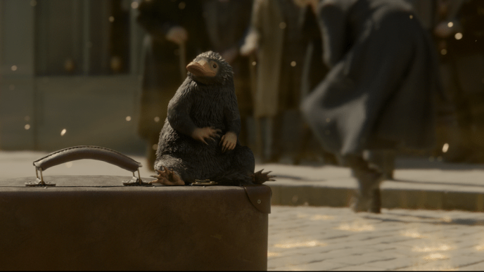 Final shot of a Niffler on a suitcase