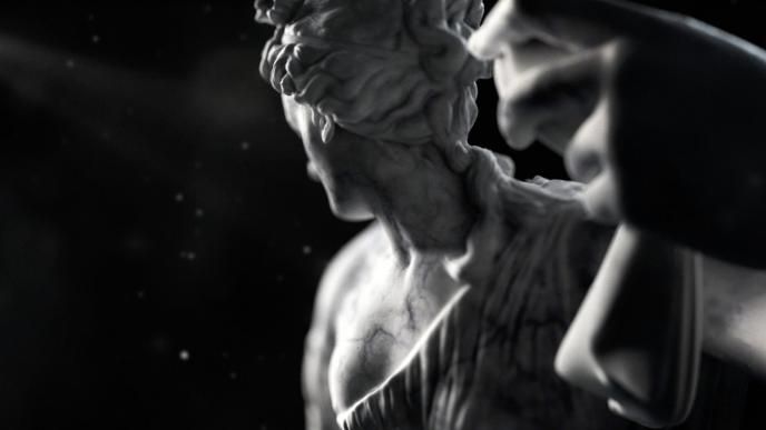 a marble statue that is looking back with its hand up