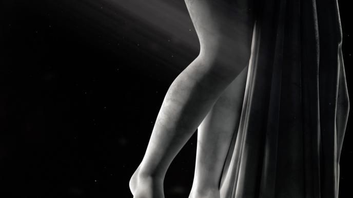 the legs of a marble statue