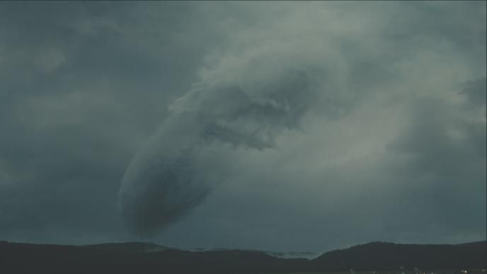 gigantic oval extraterrestrial space craft plummeting through the atmosphere and clouds