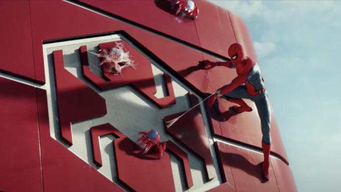 spider-man on a wall that has the spider-man logo on it