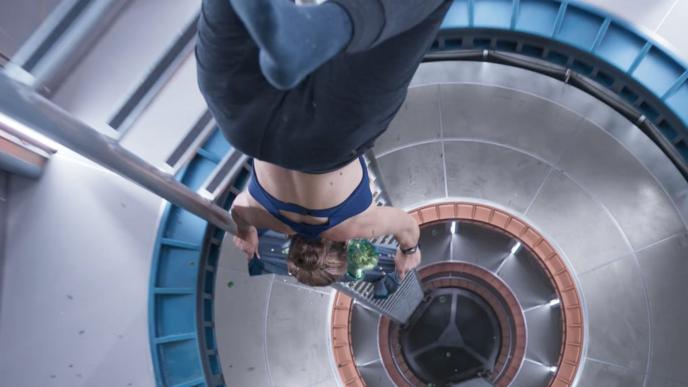 an astronaut floating inside of a spacecraft