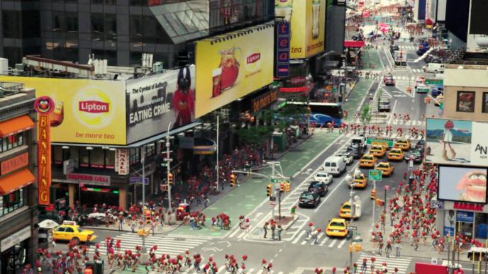 aerial street view of new york city covered in lipton tea adverts. the streets are teeming with the red muppet animal character