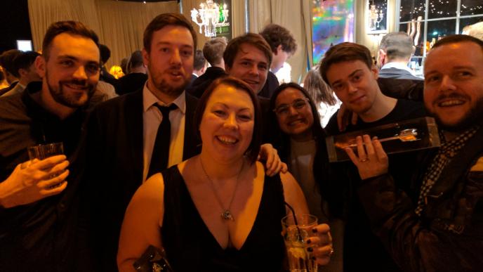 a group of people smiling at the camera