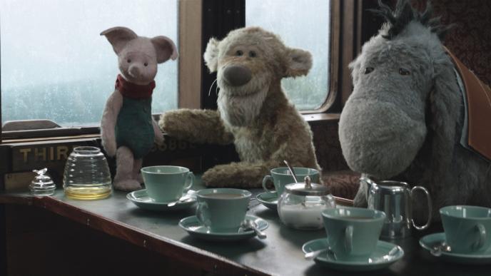 cg animated photorealistic piglet, tigger and eeyore sitting inside of a train carriage. on the carriage table there is an almost empty clear honey pot next to piglet and five tea cups with an empty tea pot in front of eeyore