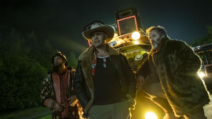 from left to right, actors guz khan as cheese, billy zane as joker jones, jason thorpe as el capitano standing in front of a truck