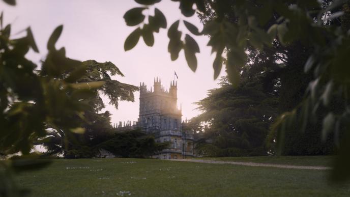 perspective of the royal household building through trees