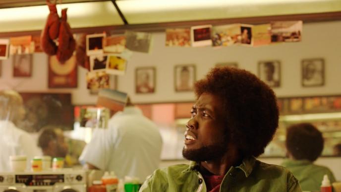a person at a barber shop with an incredulous look on their face