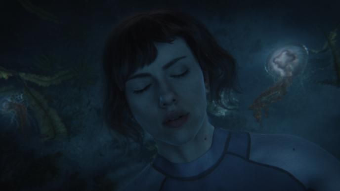 close up of actress scarlett johansson as major mira killian floating with her eyes closed