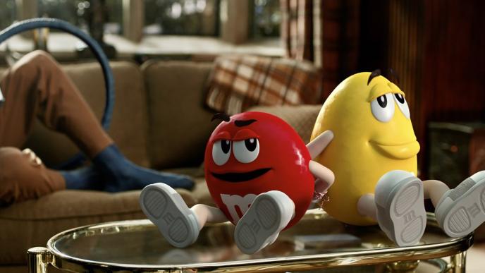 red and yellow m&ms sitting on a coffee table