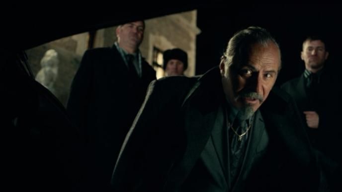 perspective from inside of a car as actors are looking inside set in nighttime