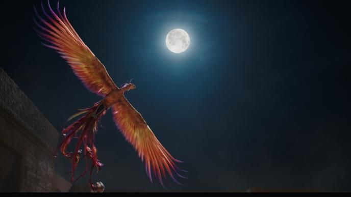 cg animated phoenix from mulan soaring in the night sky as a full moon shines brightly above