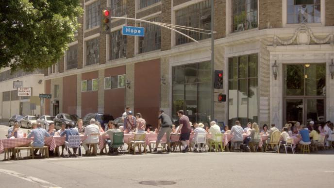 street view of a long table full of people sitting down