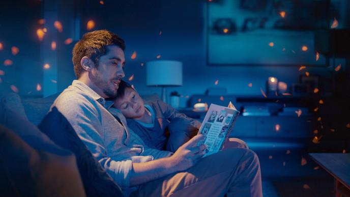 a father and child reading a bedtime story