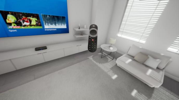 a sky tv remote control hovering mid air in a living room