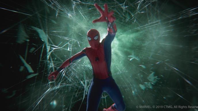 front view of spider-man falling through spider webs surrounded in green mist