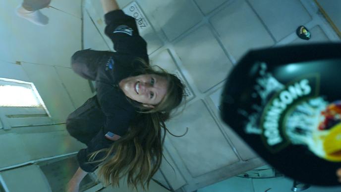 a woman in zero gravity as a robinsons branded mini squash container