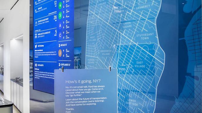 a large screen that covers the wall in the ford mobility hub store