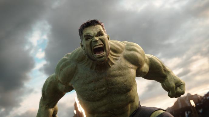 an angry hulk roaring with his hands down below a cloudy sky