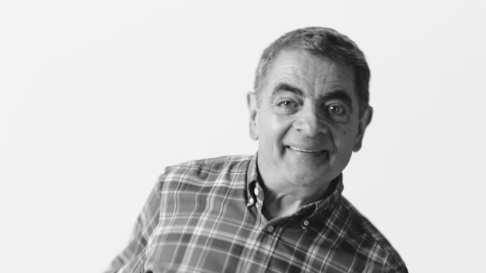 actor rowan atkinson smiling