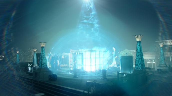 a large box room made out of glass panels lit up as light ascends from the top