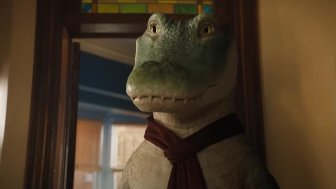 Lyle the crocodile, wearing a scarf