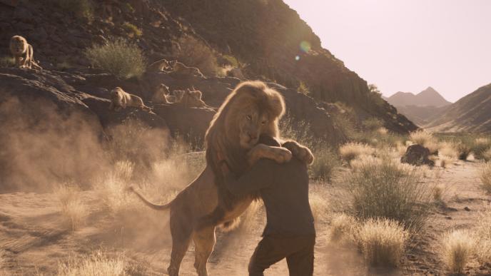 A lion embraces a man