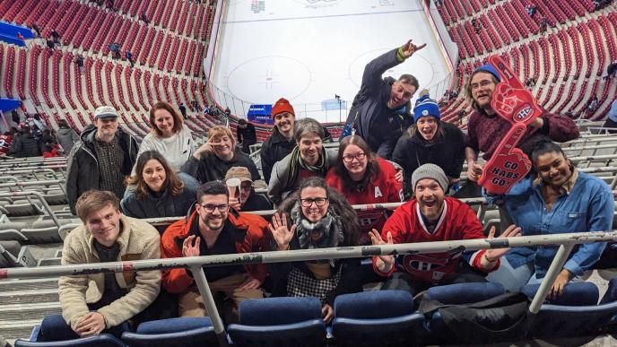 Colleagues in Montreal attend an ice hockey game