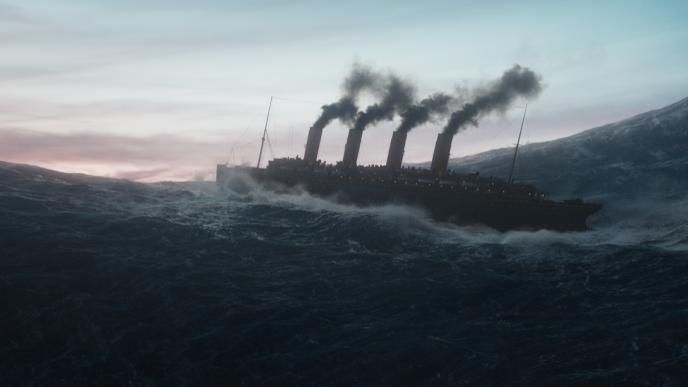 The ship from Netflix's 1899 sails towards the edge of the water, with a sunset behind, like it's about to fall off the end of the world