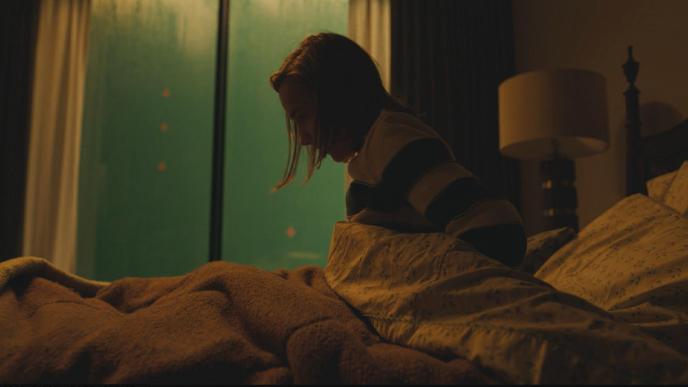In-camera footage from Slumberland, showing Nemo sitting on her bed with green screen in the background