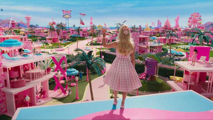 A still from Barbie showing Margot Robbie looking out over Barbie Land.