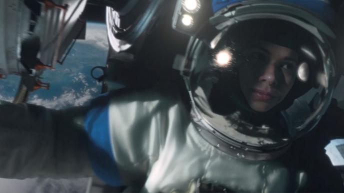 An astronaut in space with the earth in the background.