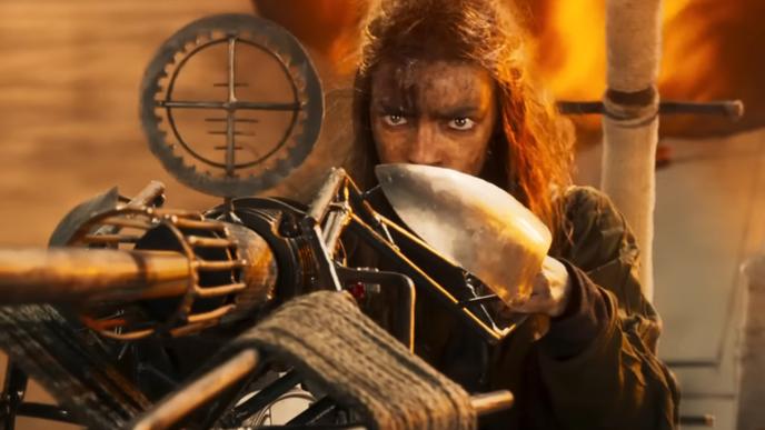 Anya Taylor Joy as a young Furiosa, pointing a large steampunk machine gun