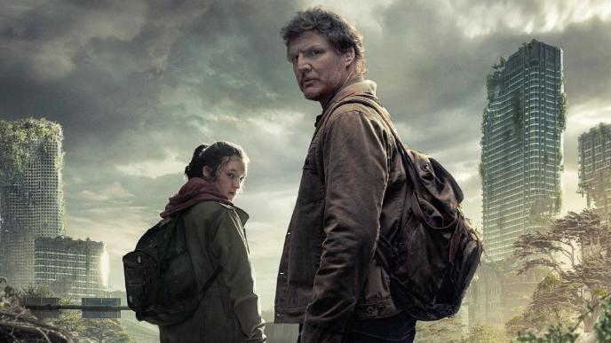 Pedro Pascal and Bella Ramsey in The Last of Us promotional shot, staring over their shoulder