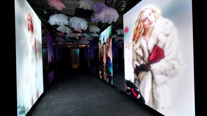 Carrie Bradshaw from 'Sex and the City' displayed on several different screens