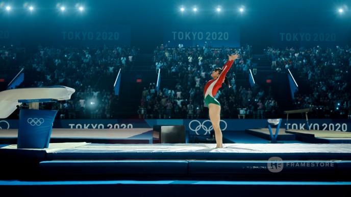 Gymnast sticking landing in advertising sports reel