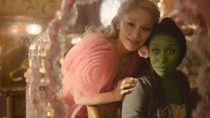 Ariana Grande as Glinda and Cynthia Erivo as Elphaba in Wicked, Glinda rests her hand on Elphaba's shoulder