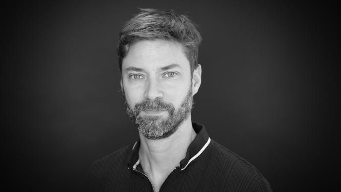 A black and white photo of Romain Rico, VFX Supervisor