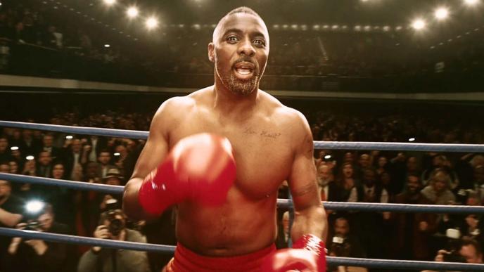 Idris Elba wearing boxing gloves 