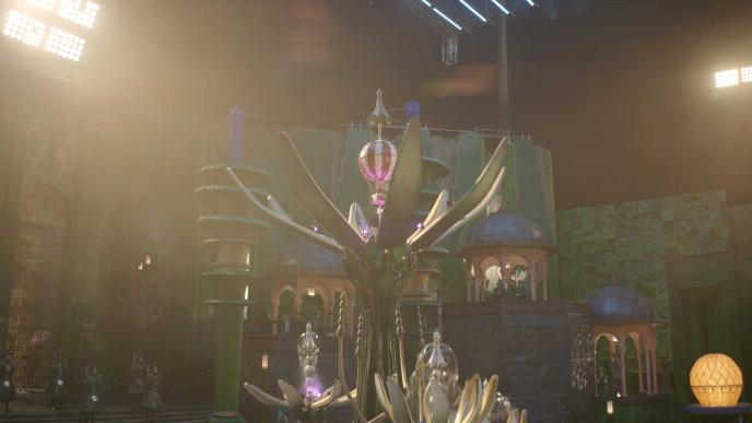 Plate footage of a fountain in Wicked's Emerald City set. Studio lights and a half-height set can be seen in the background