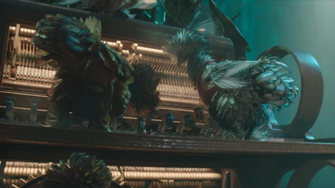 A final shot from Wicked Part one. CGI chickens in bedazzled vests play a piano with their beaks