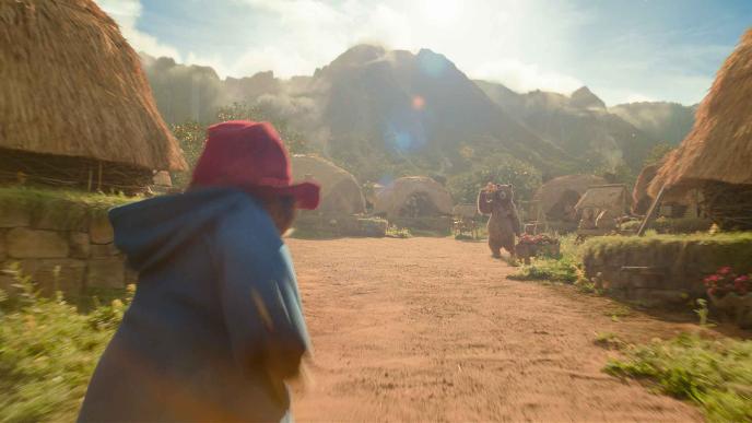 Paddington runs through the bear village