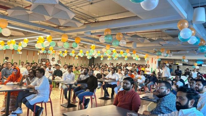Mumbai office celebrates Republic Day with employees gathered under orange, white, and green balloons for an event.