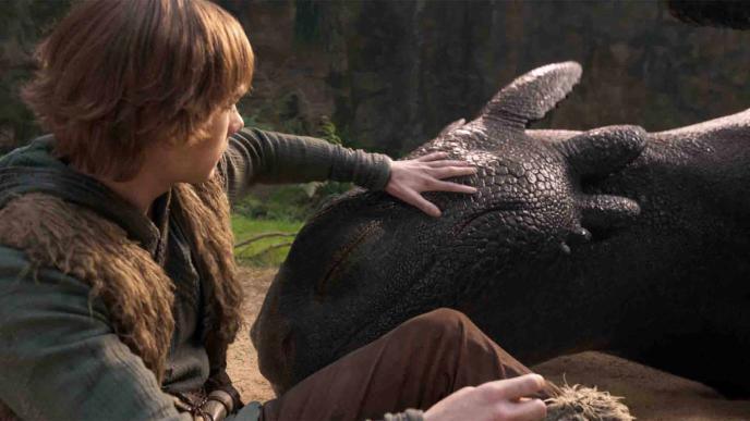 How to Train Your Dragon still of Hiccup and CG dragon Toothless