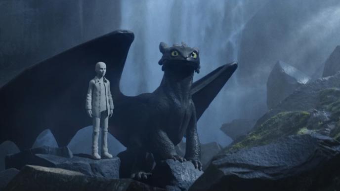 Toothless from How to Train Your Dragon in a cave with a waterfall, showcasing lifelike CGI and detailed animation in a forest setting.