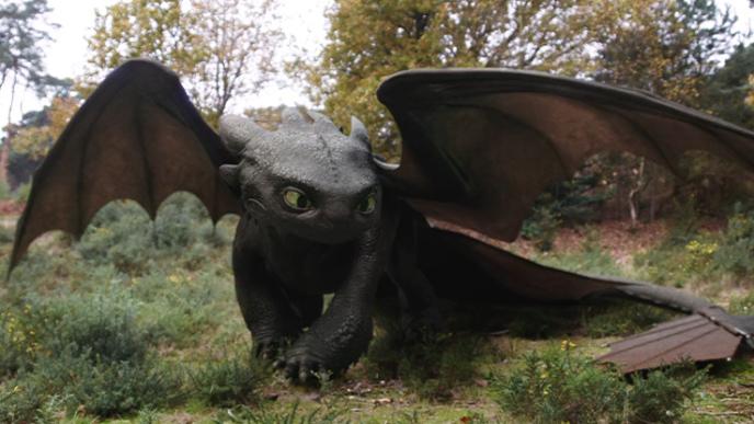 Toothless from How to Train Your Dragon, showcasing lifelike CGI and detailed animation in a forest setting.